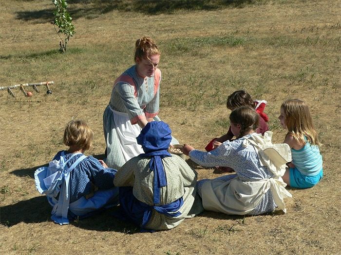 Playing pioneer games at the Ingalls Homestead.