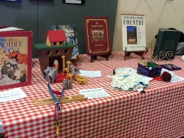 Little House on the Prairie replica and book display.