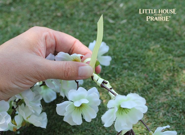 Tie the ends of the ribbons to secure the wreath.