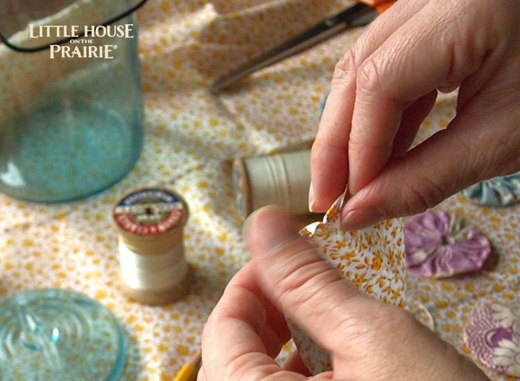 Use simple stiches around the edge of the fabric circle to begin creating your yo-yo shape.