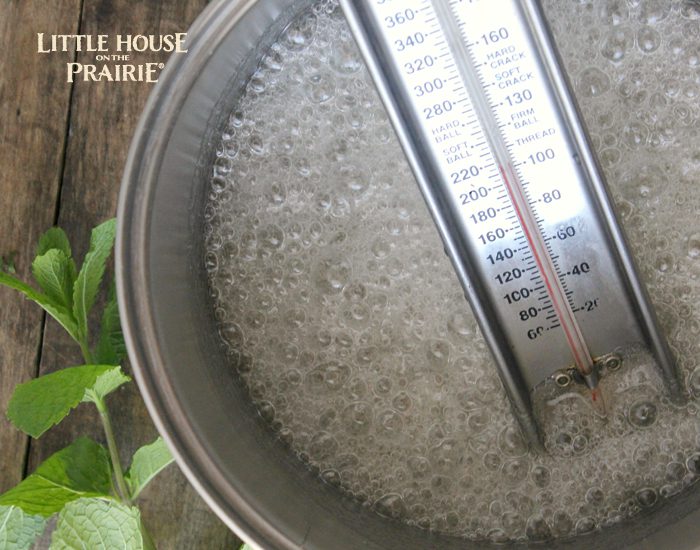 Melting the sugar for homemade peppermint sticks inspired by Little House on the Prairie