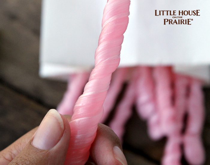 Twisting your Little House on the Prairie inspired homemade peppermint sticks.